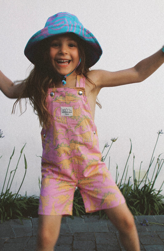 'Baby pink dinosaurs' Kids short dungaree